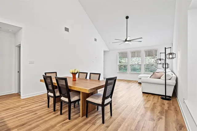 a view of a dining room with furniture window and wooden floor