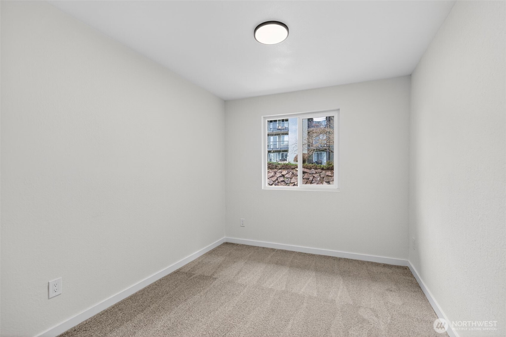 615 75th Street Southeast, Unit C53 Everett, WA 98203 - Photo 17 of 20 an empty room with a empty space and window