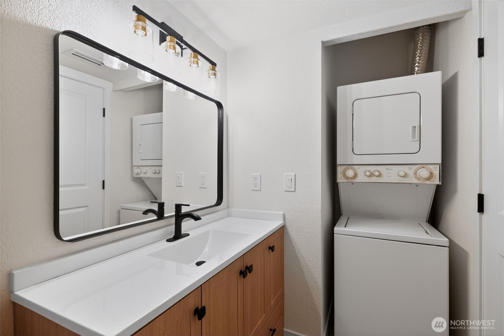 615 75th Street Southeast, Unit C53 Everett, WA 98203 - Photo 19 of 20 a bathroom with a sink and a mirror