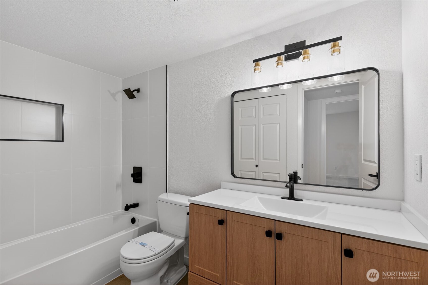 615 75th Street Southeast, Unit C53 Everett, WA 98203 - Photo 20 of 20 a bathroom with a toilet sink and mirror