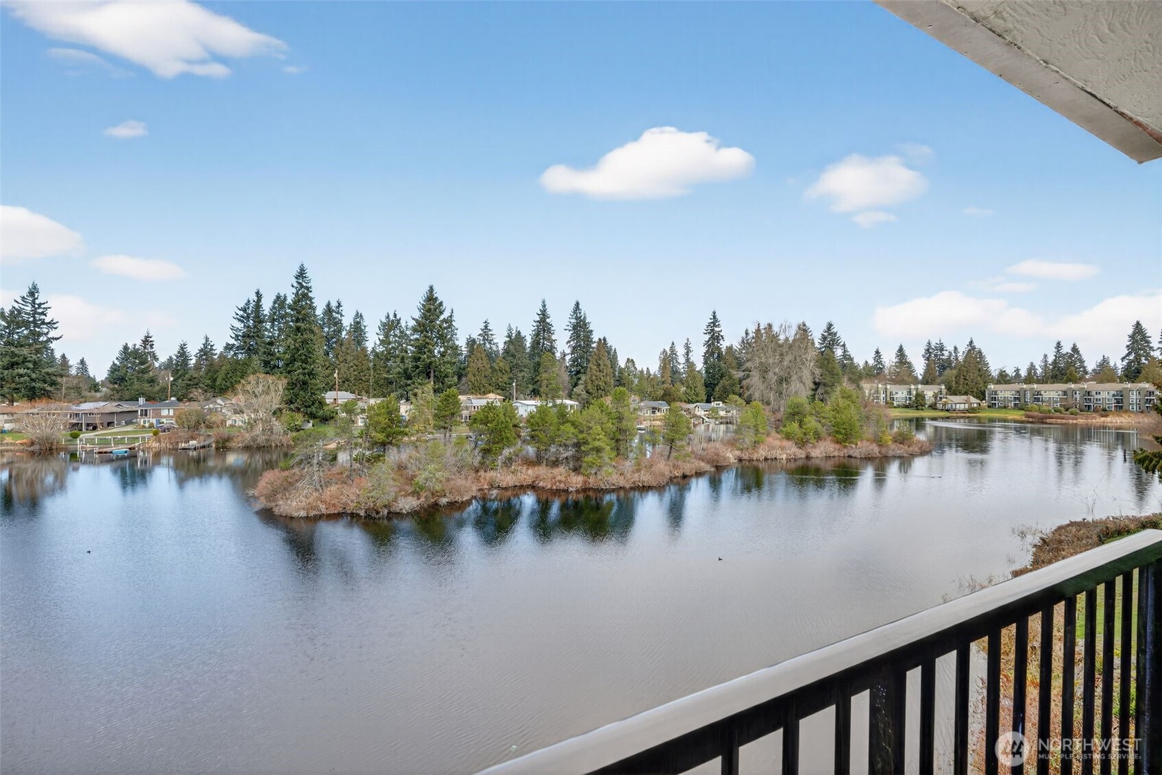 615 75th Street Southeast, Unit C53 Everett, WA 98203 - Photo 4 of 20 a view of a lake with boats and trees in the background