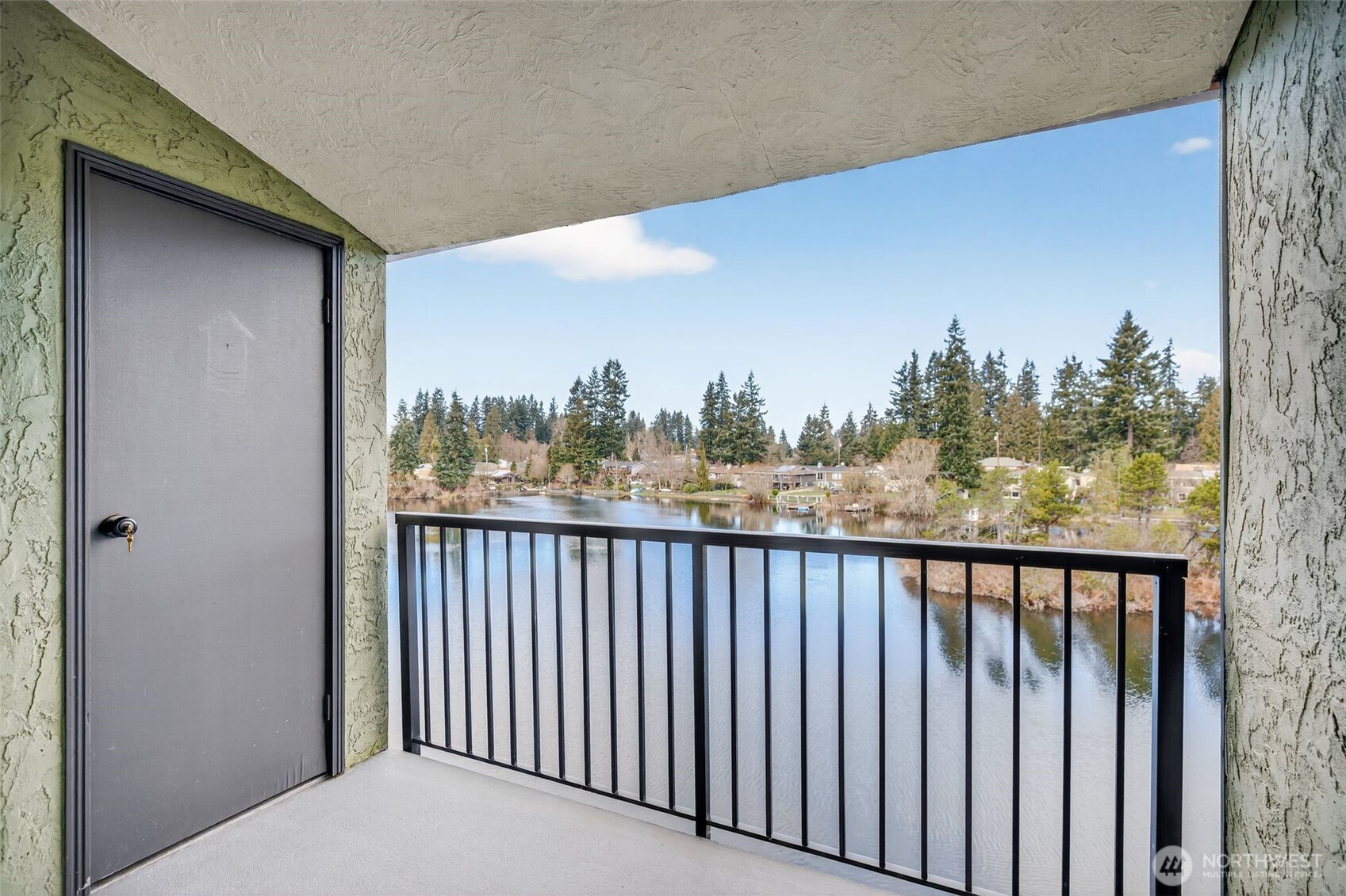 615 75th Street Southeast, Unit C53 Everett, WA 98203 - Photo 6 of 20 a balcony with wooden floor and fence