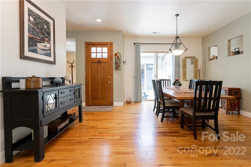 2391 Paint Fork Road Mars Hill, NC 28754 - Photo 14 of 45 a view of a dining room with furniture window and wooden floor