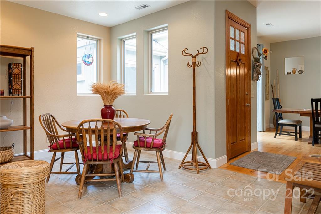 2391 Paint Fork Road Mars Hill, NC 28754 - Photo 15 of 45 a view of a dining room with furniture and a window