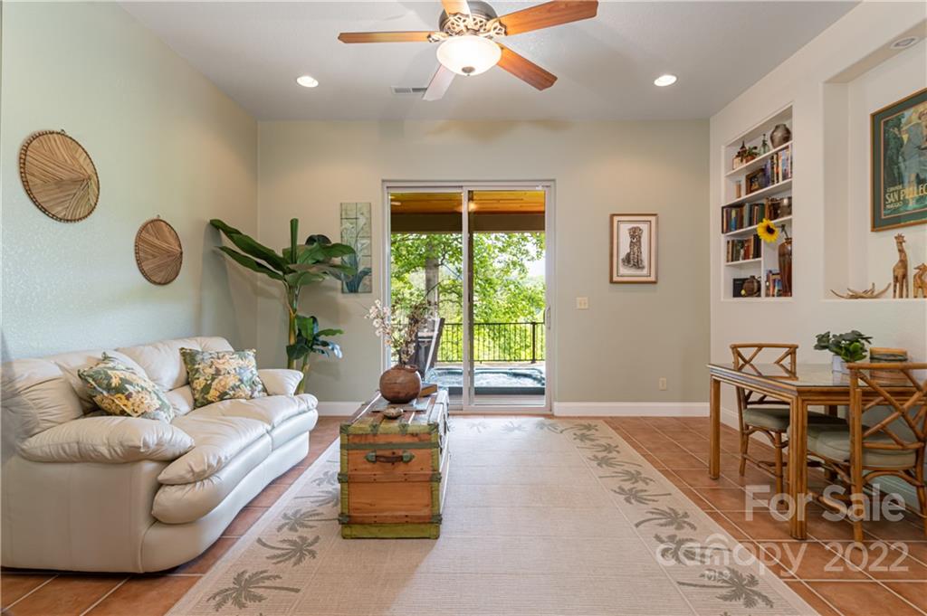 2391 Paint Fork Road Mars Hill, NC 28754 - Photo 19 of 45 a living room with furniture and a large window