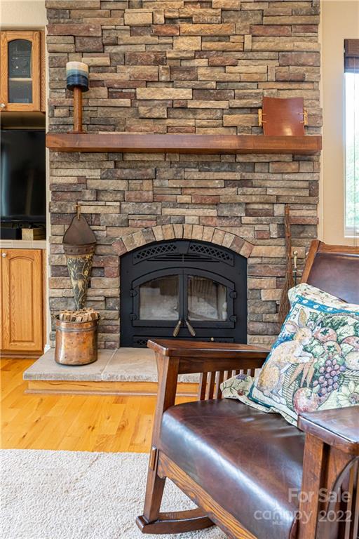 2391 Paint Fork Road Mars Hill, NC 28754 - Photo 20 of 45 a living room with furniture and a fireplace