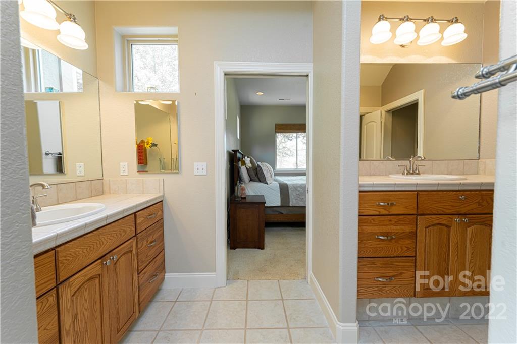 2391 Paint Fork Road Mars Hill, NC 28754 - Photo 27 of 45 a bathroom with a sink a vanity and a mirror