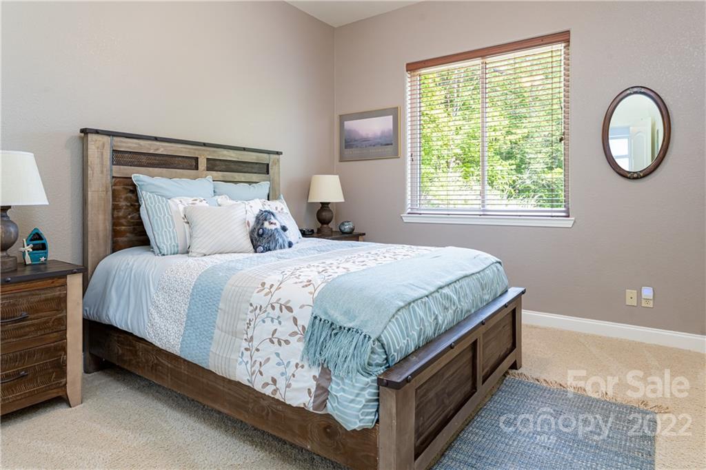 2391 Paint Fork Road Mars Hill, NC 28754 - Photo 29 of 45 a bed sitting in a bedroom next to a window