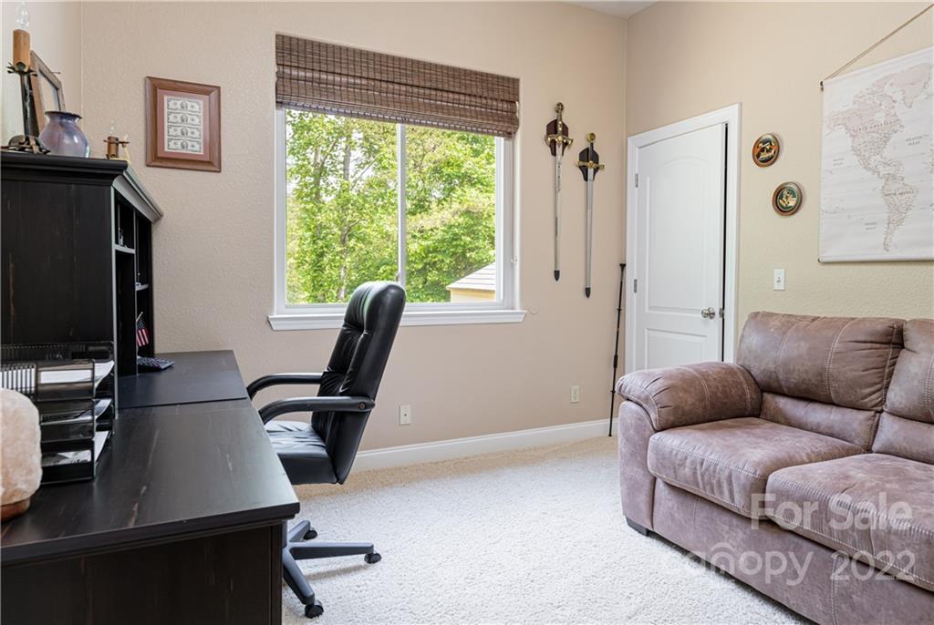 2391 Paint Fork Road Mars Hill, NC 28754 - Photo 30 of 45 a living room with furniture and a flat screen tv