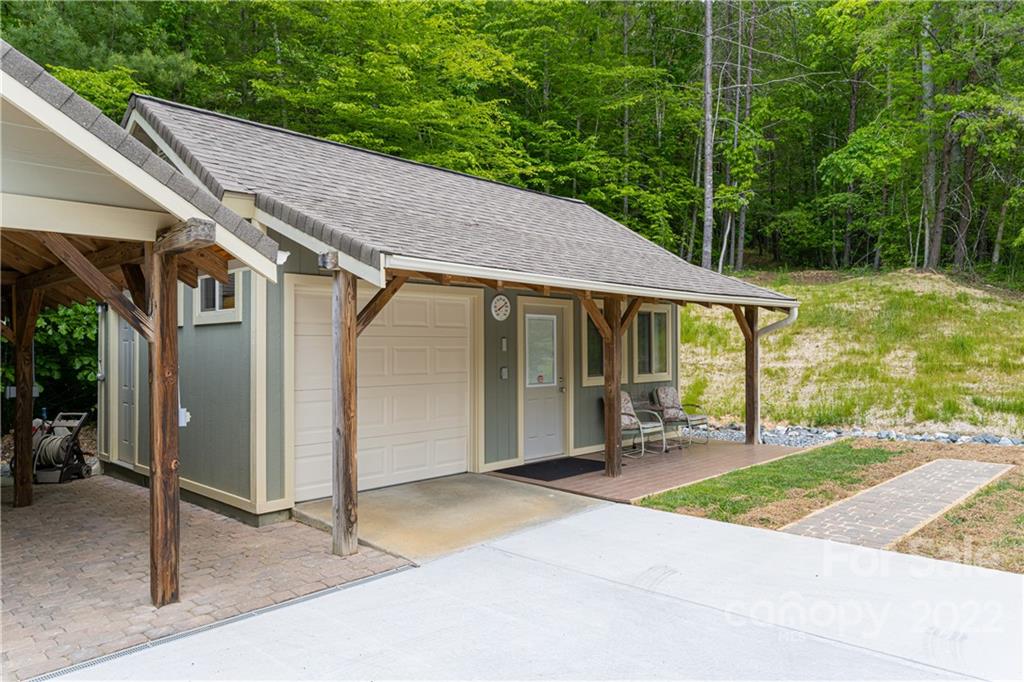 2391 Paint Fork Road Mars Hill, NC 28754 - Photo 34 of 45 a patio with a yard table and chairs