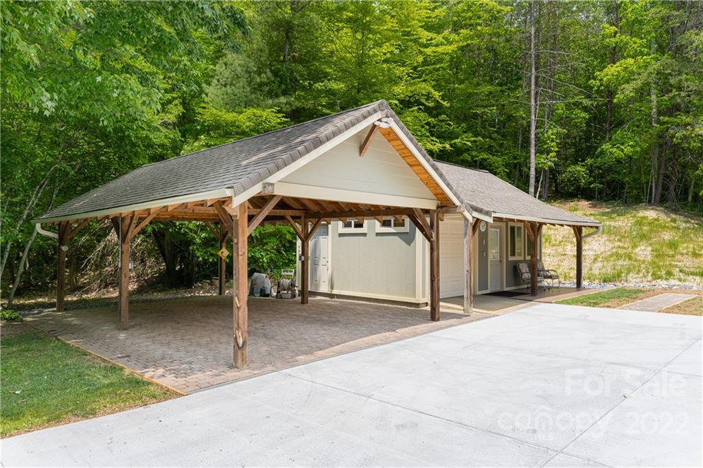 2391 Paint Fork Road Mars Hill, NC 28754 - Photo 36 of 45 a view of a house with backyard and a car parked
