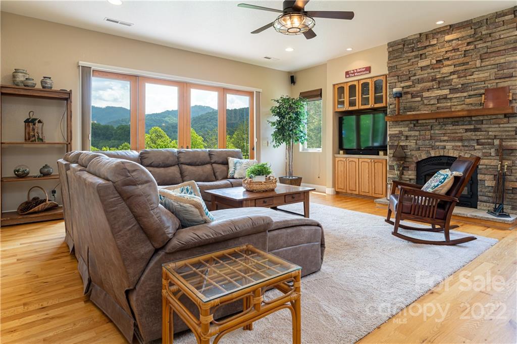 2391 Paint Fork Road Mars Hill, NC 28754 - Photo 4 of 45 a living room with furniture and a fireplace