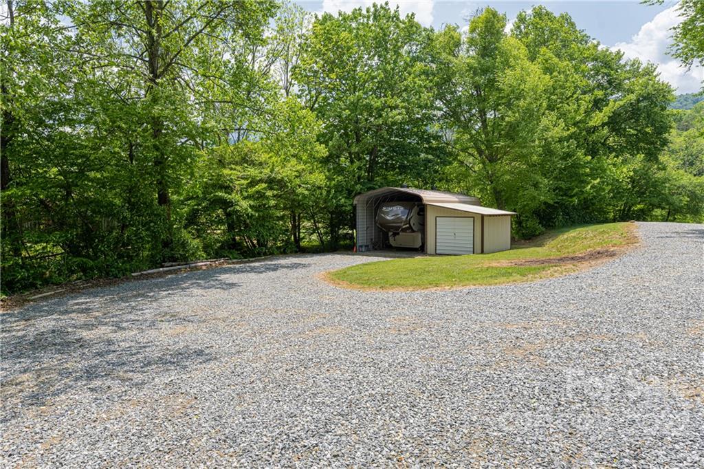 2391 Paint Fork Road Mars Hill, NC 28754 - Photo 43 of 45 a view of a house with a yard