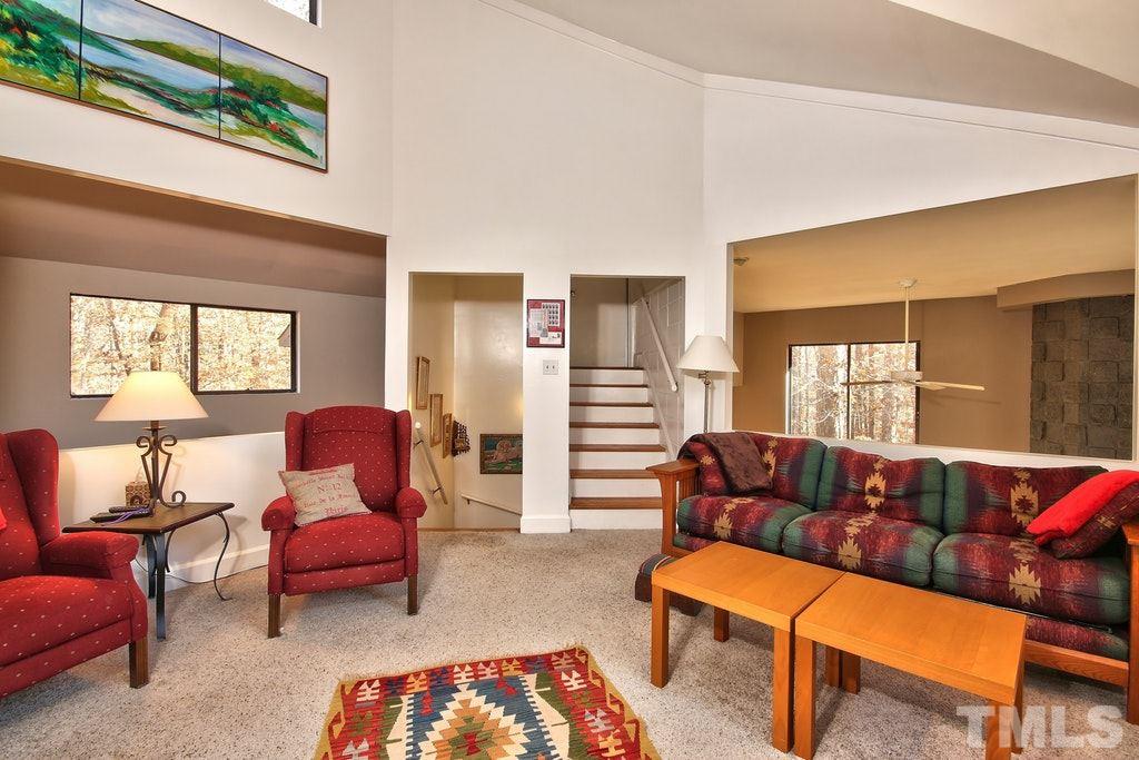 11312 Saddleview Court Raleigh, NC 27613 - Photo 13 of 25 Great space for a bonus room! Overlooks the dining room and includes carpet and bookshelves! Cozy up and read a great book up here or enjoy a good movie.