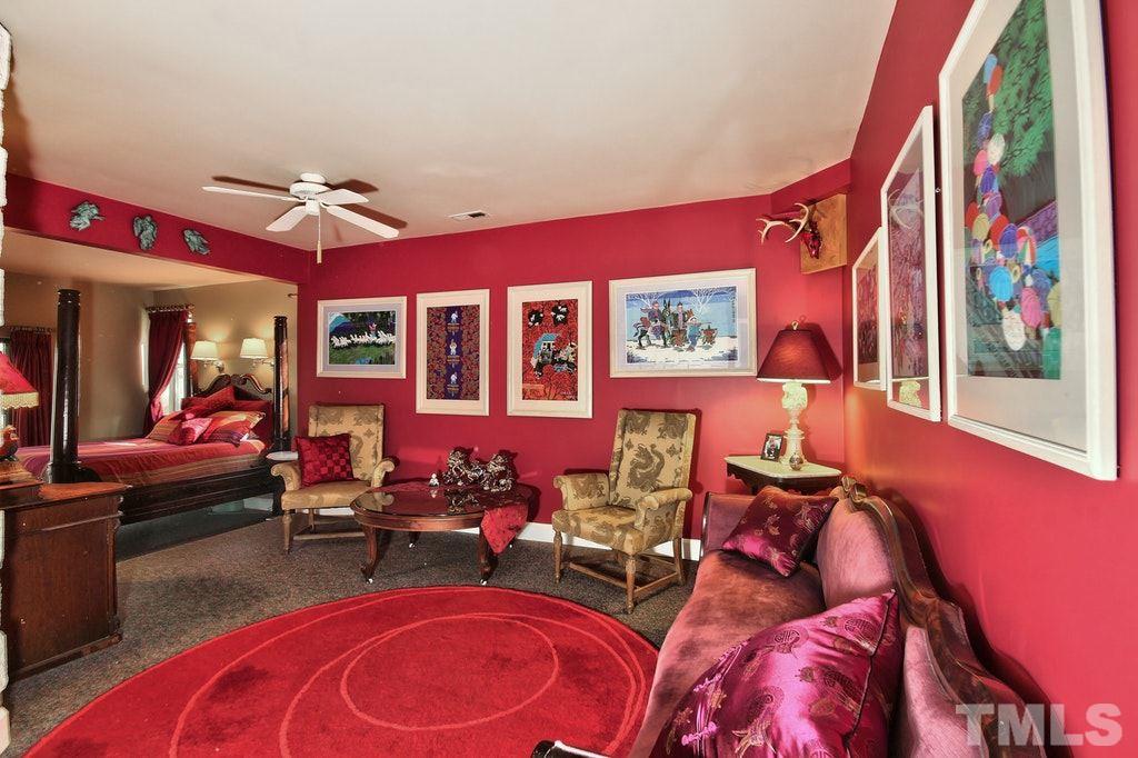 11312 Saddleview Court Raleigh, NC 27613 - Photo 18 of 25 Master bedroom with a HUGE sitting room! Hide out in your master with the comforts of a living or family room! Sliding glass doors open to the beautifully landscaped back yard and hot tub to soak in and enjoy a glass of wine.
