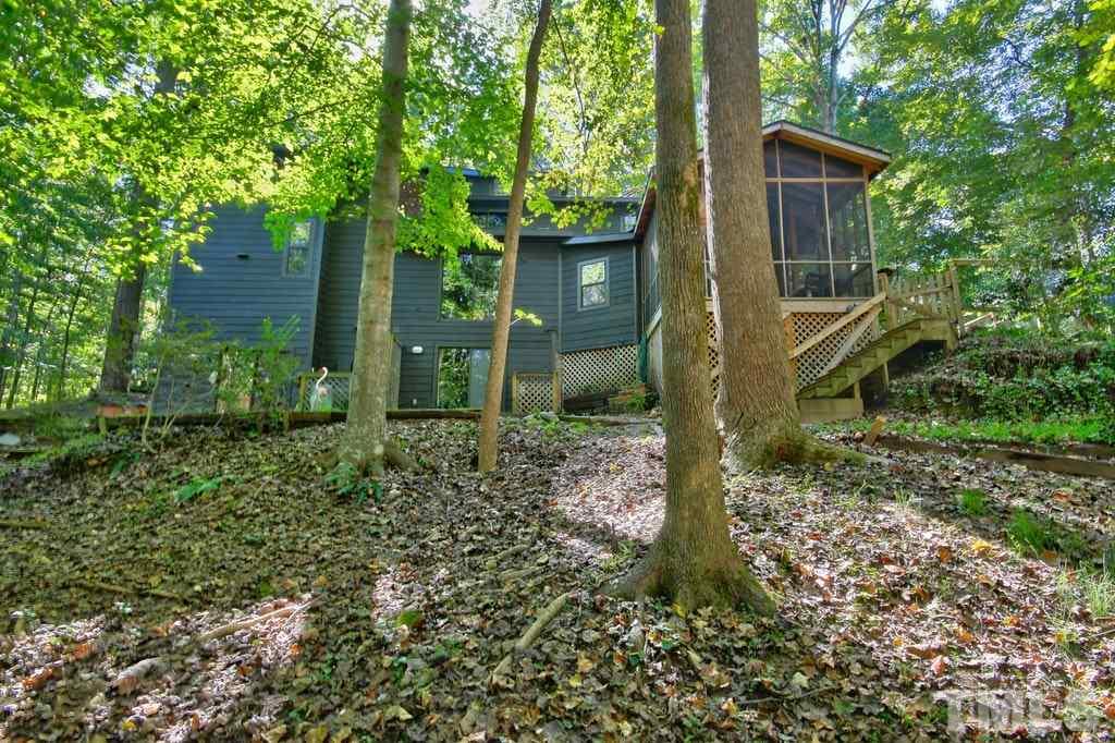11312 Saddleview Court Raleigh, NC 27613 - Photo 24 of 25 Mature landscaping and partially cleared lot that is 1.5 acres!