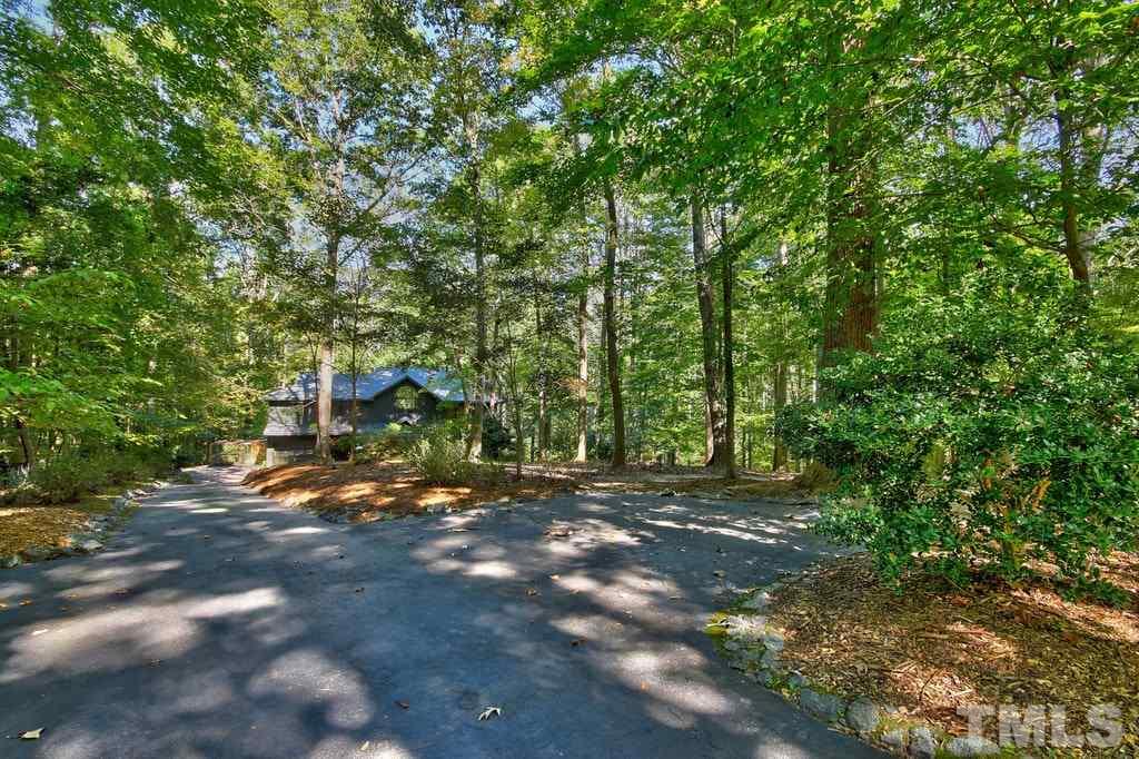 11312 Saddleview Court Raleigh, NC 27613 - Photo 4 of 25 A view of the home from the privately maintained street in a cul de sac. Community features tennis courts and a private community pool.