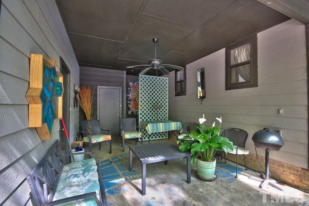 11312 Saddleview Court Raleigh, NC 27613 - Photo 6 of 25 While there is a carport for additional parking, this space is currently being used as an entertainment area to view the beautiful front landscaping of the home. Relax in the NC weather while having shaded covering!