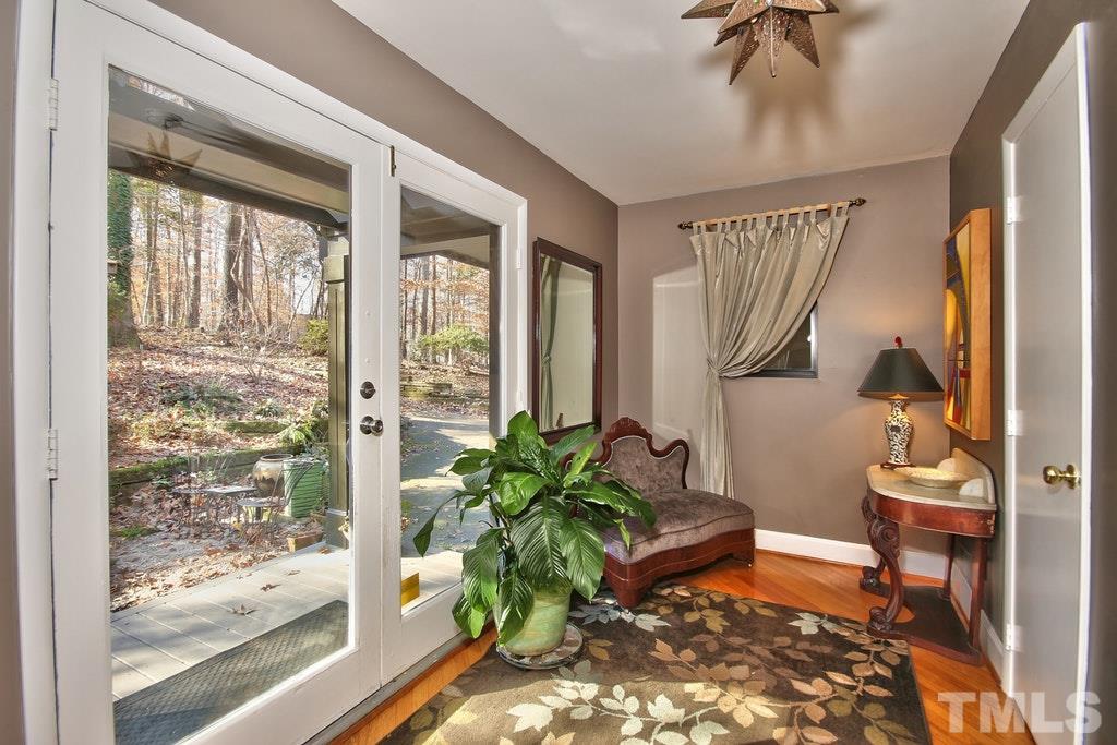 11312 Saddleview Court Raleigh, NC 27613 - Photo 7 of 25 Welcoming and inviting! This large foyer is just a glimpse of the modern touches in your new home! Hardwoods throughout the downstairs, except in the Studio. Tons of natural light throughout.