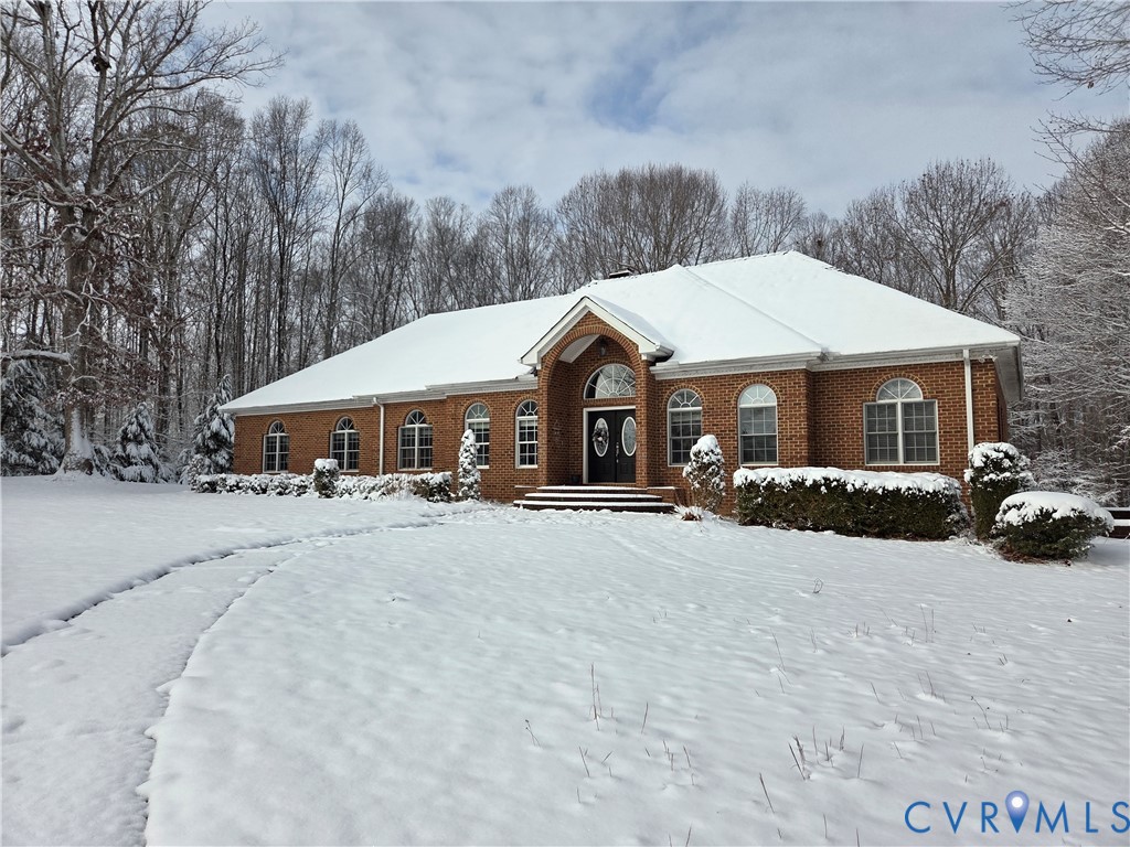 239 Jennings Road Cartersville, VA 23027 - Photo 2 of 26 Brick facade residence featuring an arched entrywa