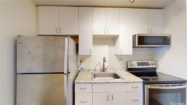 a kitchen with a refrigerator sink and stove