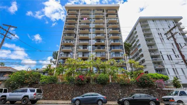 a building with trees in front of it