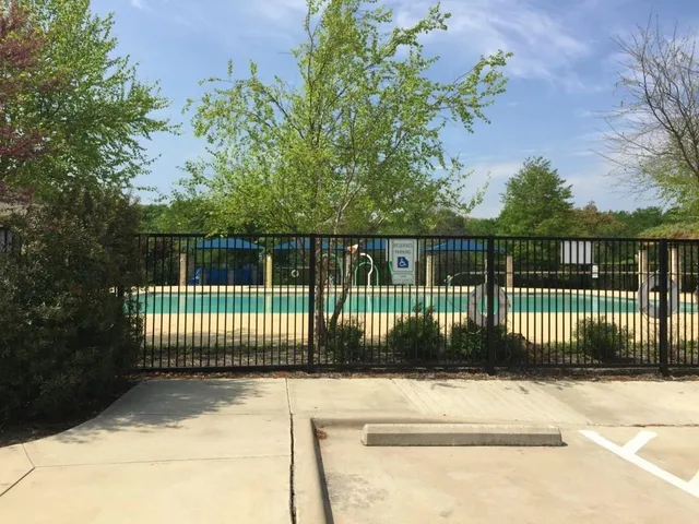 a view of a gate with a garden