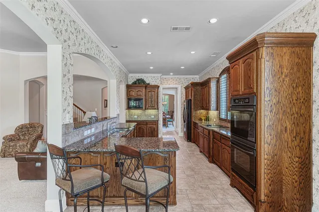 a view of a room with a large window and bed