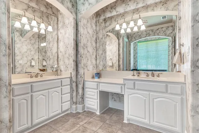 a bathroom with a bathtub and a window