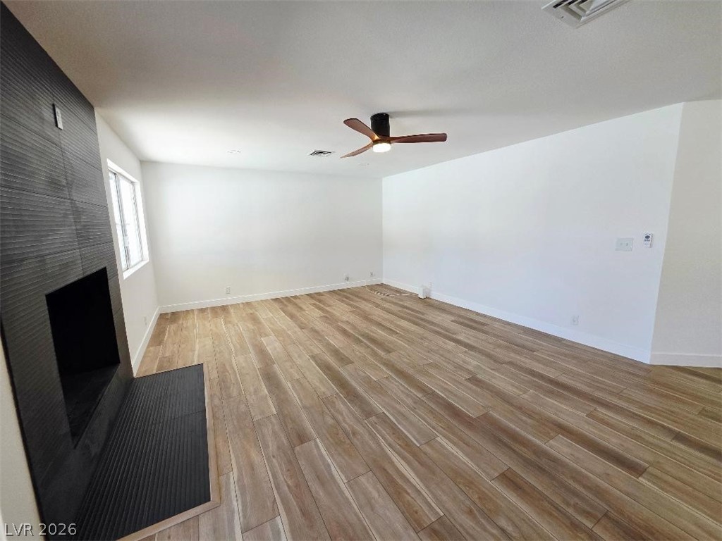 3420 West Warm Springs Road Las Vegas, NV 89118 - Photo 19 of 50 living room with light wood-style flooring and ceiling fan