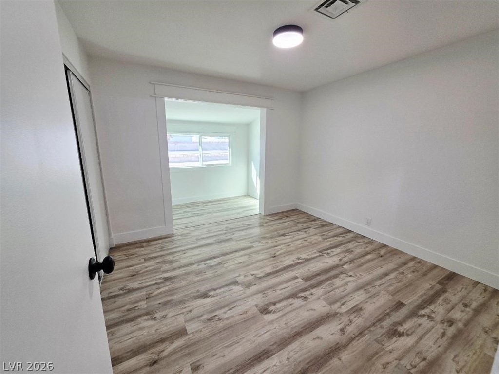 3420 West Warm Springs Road Las Vegas, NV 89118 - Photo 31 of 50 Bedroom 2 light wood finished floors and baseboards