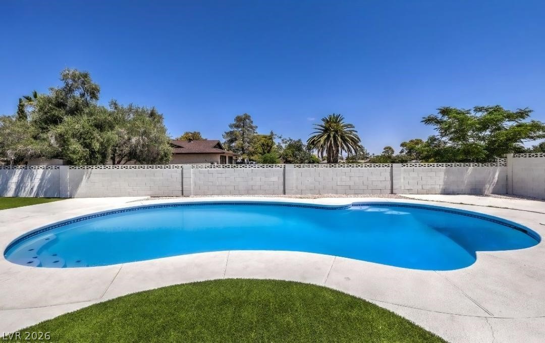 3420 West Warm Springs Road Las Vegas, NV 89118 - Photo 41 of 50 View of swimming pool with a fenced backyard and patio surround