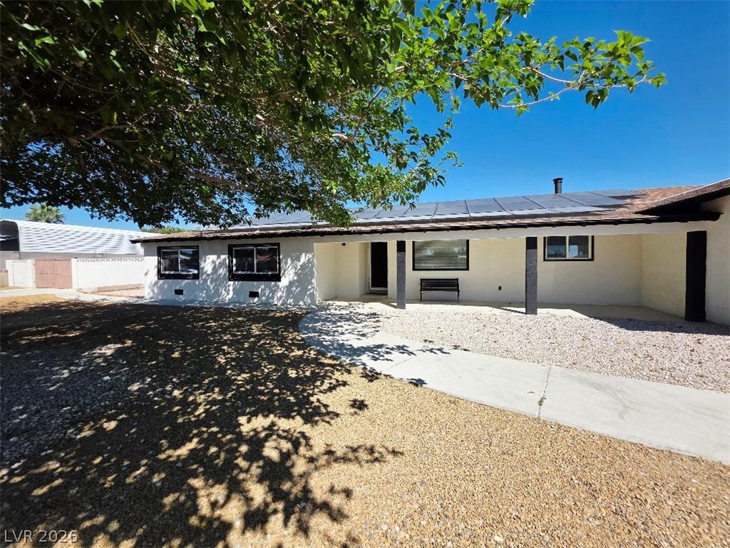 3420 West Warm Springs Road Las Vegas, NV 89118 - Photo 44 of 50 Ranch-style home with solar panels and stucco siding