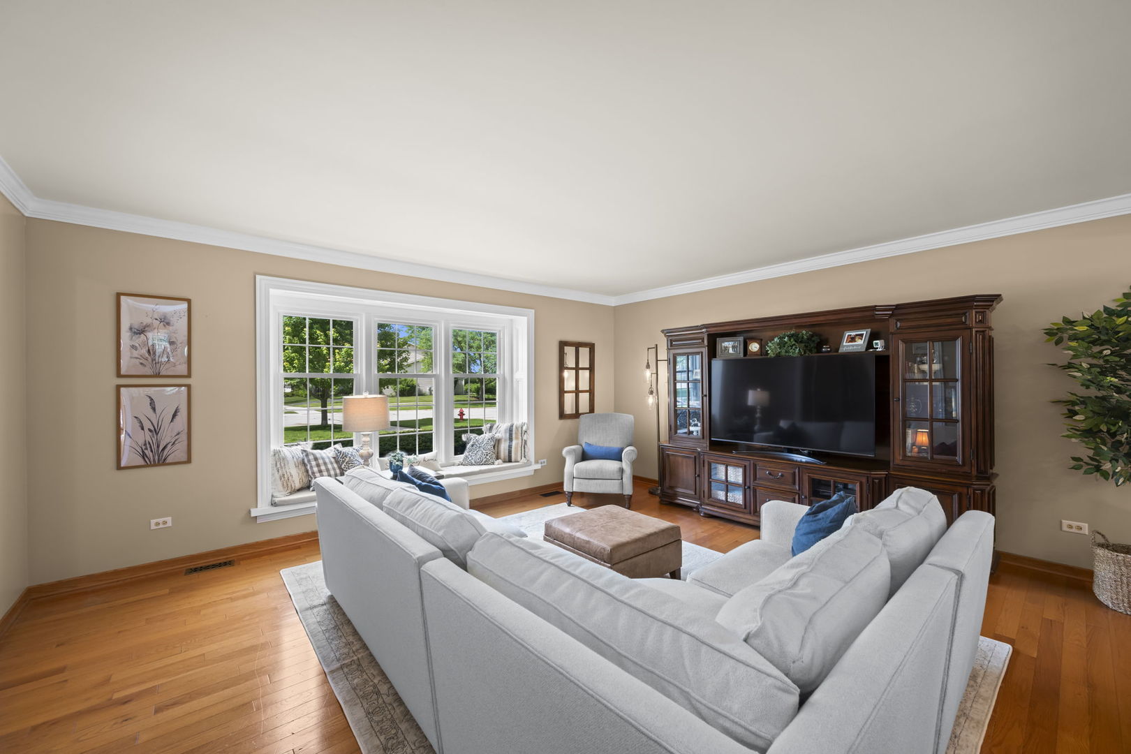 1565 Freeman Road Hoffman Estates, IL 60192 - Photo 11 of 46 a living room with furniture and a flat screen tv