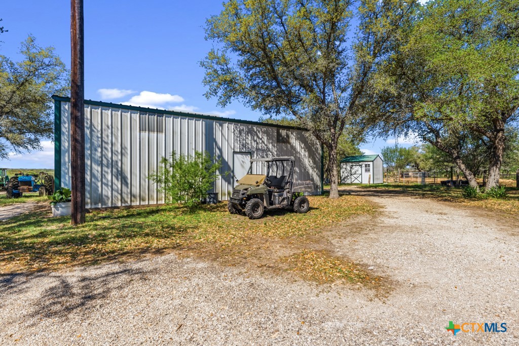 2632 Slickfield Road Yorktown, TX 78164 - Photo 20 of 33 a view of a backyard with tree