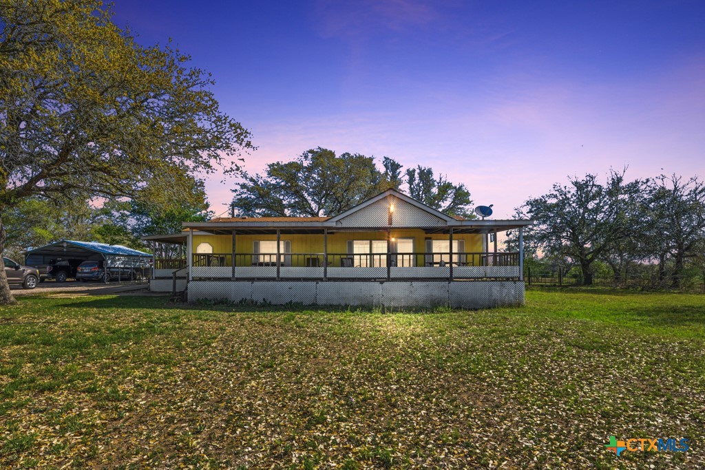 2632 Slickfield Road Yorktown, TX 78164 - Photo 2 of 33 a front view of a house with a yard