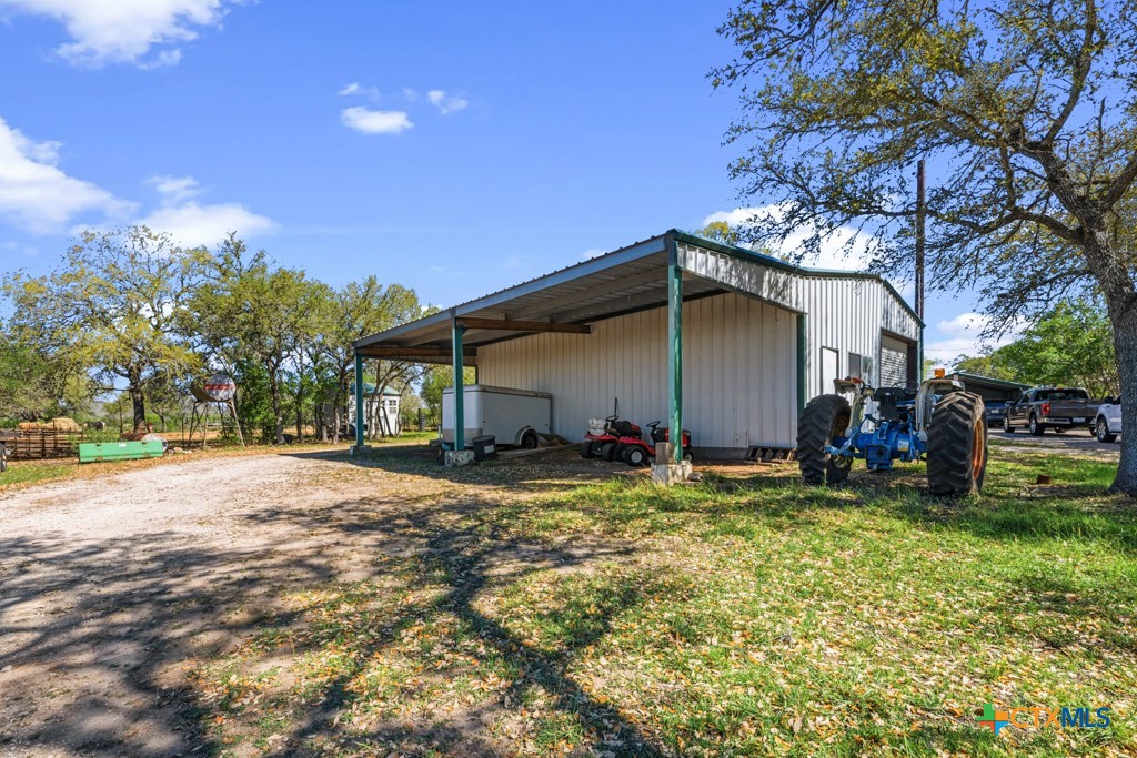 2632 Slickfield Road Yorktown, TX 78164 - Photo 21 of 33 a view of a house with backyard and sitting area
