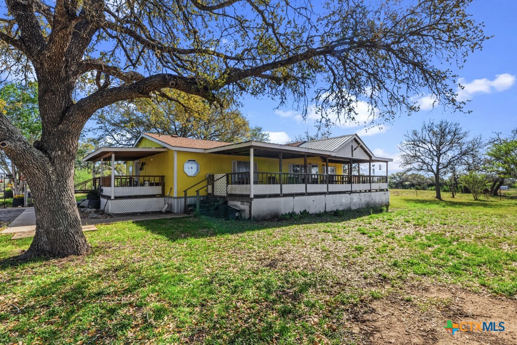 2632 Slickfield Road Yorktown, TX 78164 - Photo 4 of 33 a view of house with outdoor entertaining spaces