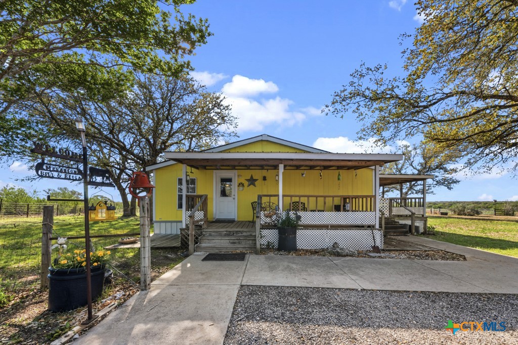2632 Slickfield Road Yorktown, TX 78164 - Photo 5 of 33 a front view of a house with a yard