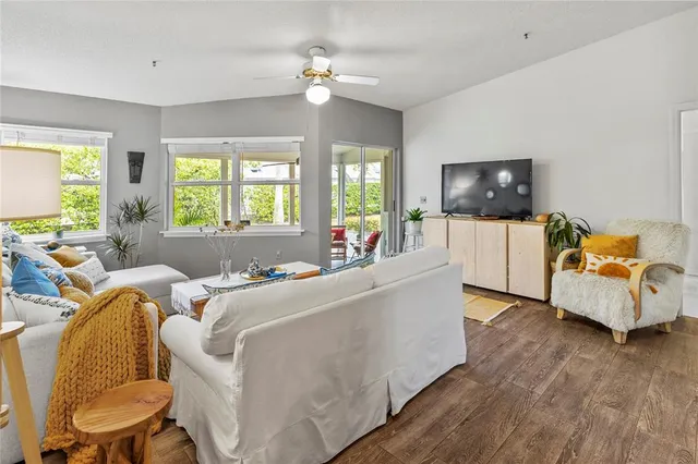 a living room with fireplace furniture and a flat screen tv