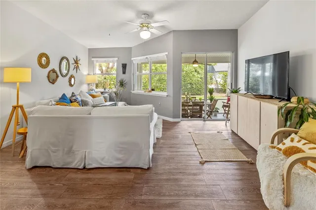 a view of a dining room with furniture and a potted plant