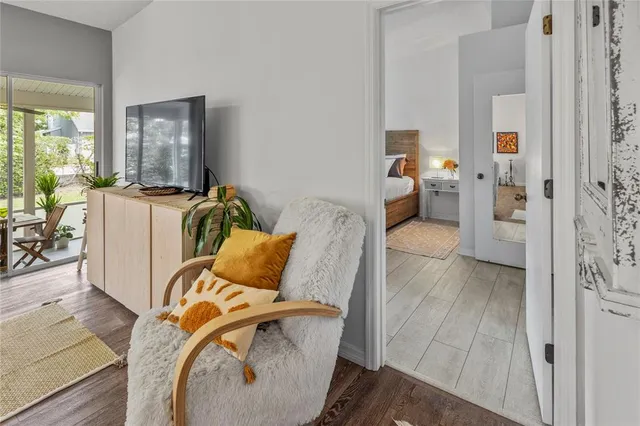 a bedroom with a bed and a night stand