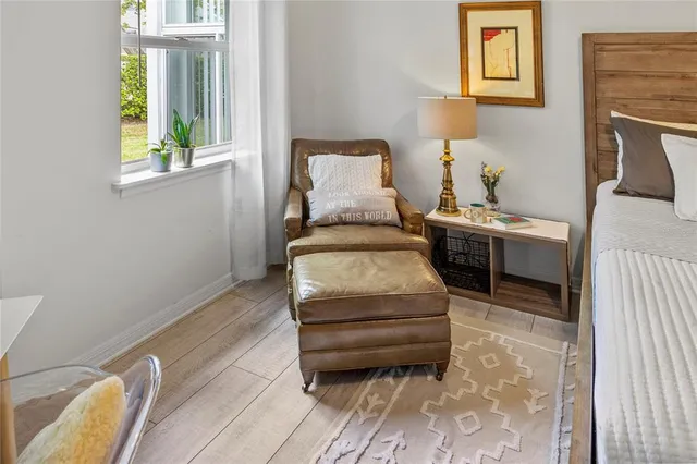 a bedroom with two beds and a window