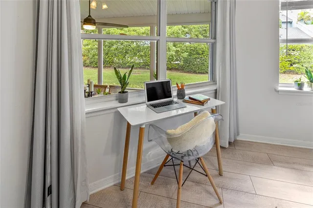 a bedroom with two beds and a window