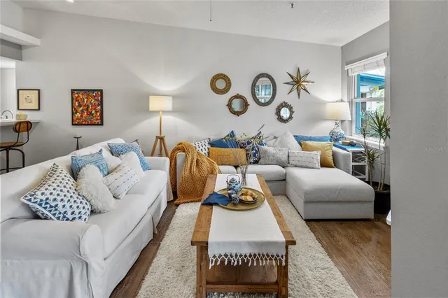 a living room with furniture and a large window