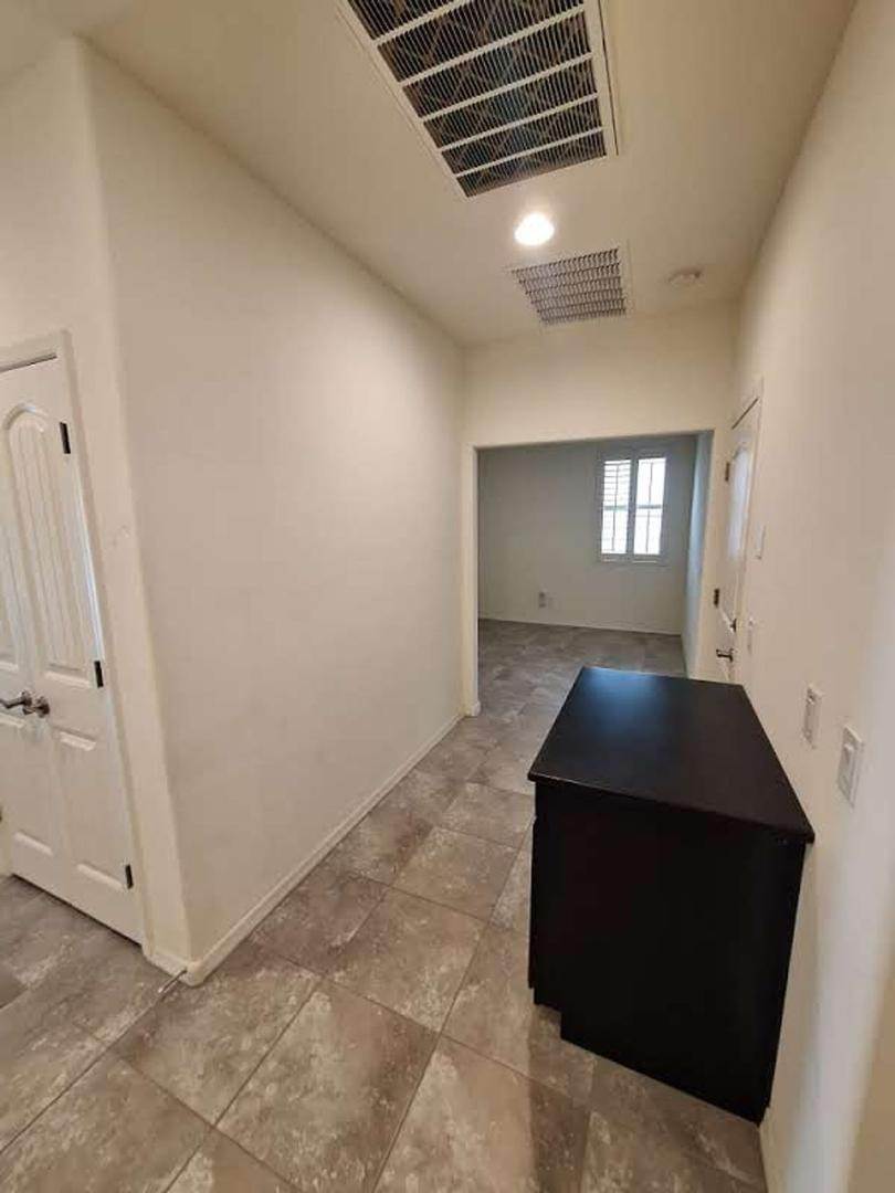 18541 West Mescal Street Surprise, AZ 85388 - Photo 25 of 31 a room with table and window
