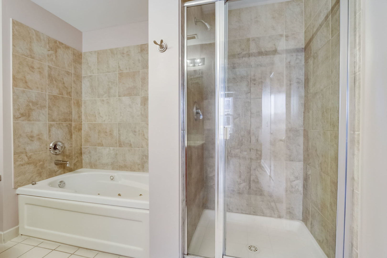 111 South Morgan Street, Unit 505 Chicago, IL 60607 - Photo 14 of 23 a bathroom with a bathtub and a shower