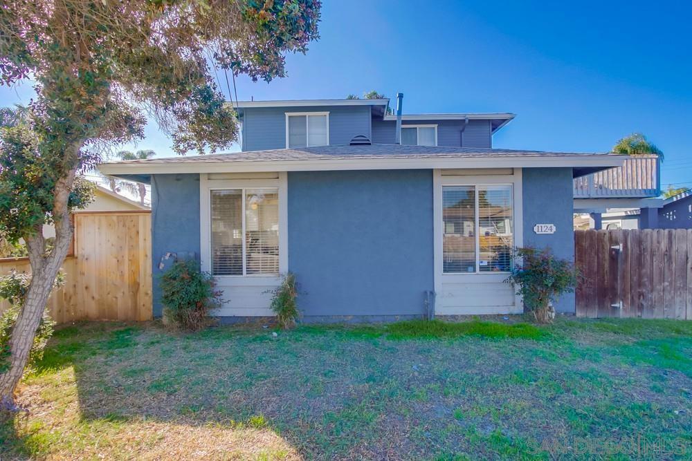 1122 11th Street Imperial Beach, CA 91932 - Photo 11 of 23 a view of a house with brick walls and a yard