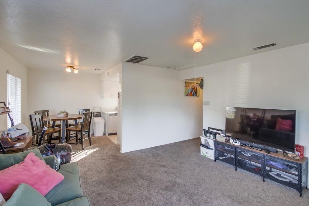 1122 11th Street Imperial Beach, CA 91932 - Photo 13 of 23 a living room with furniture and a flat screen tv