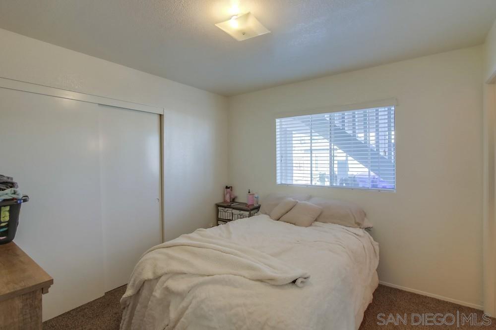 1122 11th Street Imperial Beach, CA 91932 - Photo 15 of 23 a bedroom with a bed and a window